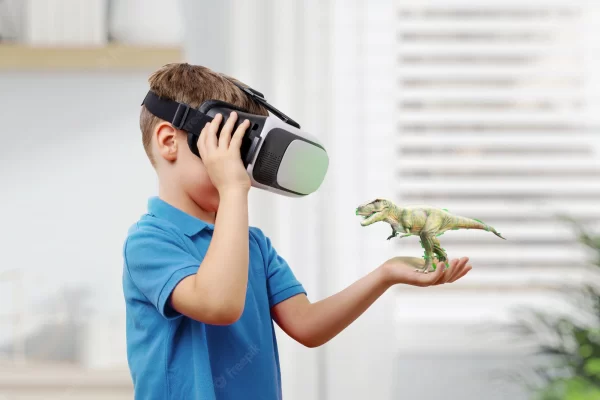 Boy with VR glasses projects a dinosaur on his arm